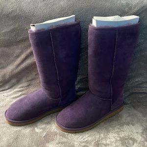 Woman’s 8 knee high purple UGG boots.